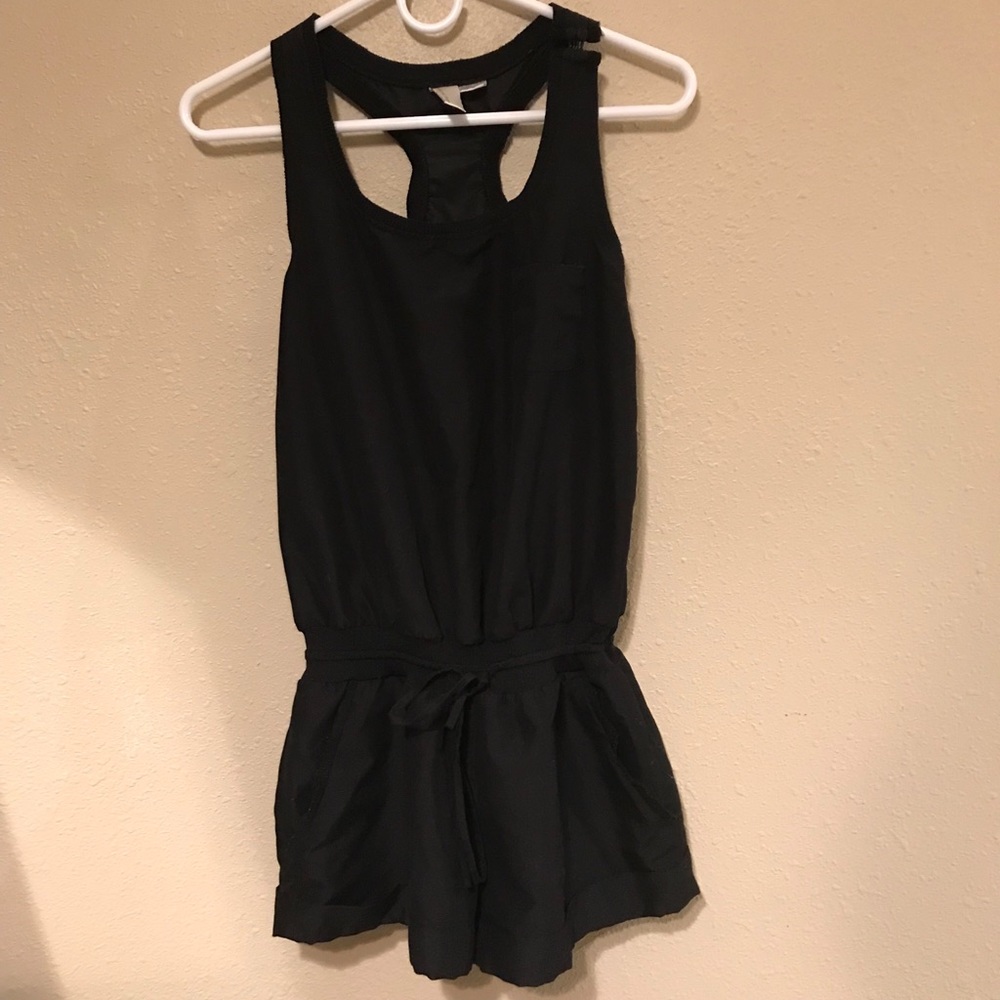 Black romper 100% polyester with waist cincher